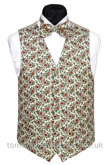 Festive Floral Patterned Christmas Waistcoat-A morris-inspired traditional festive pattern of poinsetta and foliage on a rich cream background. Waistcoat Style- TS353- Front Fabric- Cotton- Colour- Red and green on rich Cream- Buttons- Fabric Covered- - Back & Lining- Rich Cream Satin- You can click here to view our waistcoat size chart. -