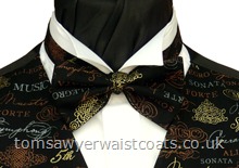 This bowtie features a pattern of musical terms such as symphony, allegro, forte, opera, sonata in grey, gold and copper shades on a black background. Style- Pre-Tied Bowtie- Colour- Grey, gold, copper on black- Fabric- Cotton-