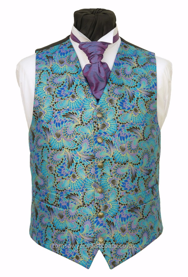 The striking colours of this 'feathers and wings' waistcoat include shades of Turquoise, blue, cornflower blue and lavender with gold detail. A fabulous choice as a wedding waistcoat or if looking for a striking waistcoat for evening or day wear. - Waistcoat Style- TS508- Front Fabric- 100% Cotton Print- Colour- Shades of Turquoise, Blue and Lilac- Buttons- Gold Patterned- Back & Lining- Black Polyester Taffeta- Please choose the size you require....