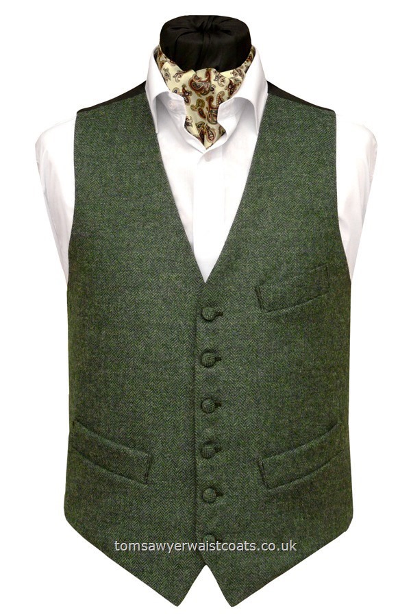 This green tweed waistcoat has a subtle herringbone weave and is made from 100% pure new wool, woven in the UK. Waistcoat Style- TS340- Fabric- 16oz wool tweed- Colour- Green- Buttons- Fabric covered- Back & Lining- Black Polyester- You can click here to view our waistcoat size chart.