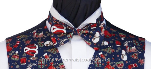 A Christmas ready tied bow tie featuring santa's favourites on a blue background. - Style- TS559N Ready Tied Bow Tie- Fabric- Cotton- Colour- Multi on Blue-