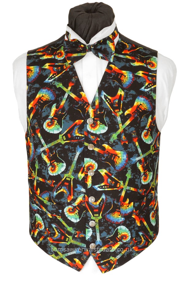 Red, yellow, green, turquoise and blue guitars feature on a black background to create this funky music theme waistcoat. Available in extra long length as well as extra large sizes. Waistcoat Style- TS565- Front Fabric- Cotton- Colour- Multi on Black Background - Buttons- Silver Pattern Metal Effect- Back & Lining- Black Polyester- You can click here to view our waistcoat size chart.