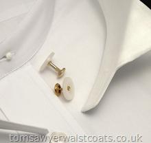 A pair of collar studs for affixing detachable collars to collarless legal shirts. -Includes one longer stud for the front and one shorter stud for the back of the collar. Goods usually dispatched within two working days.